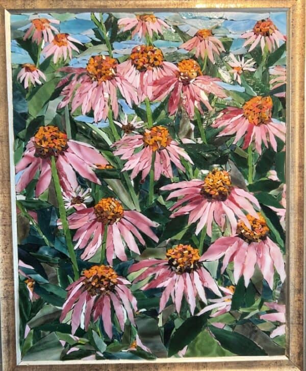 A painting of pink flowers in the grass.