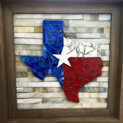 A picture of the state of texas made out of glass.