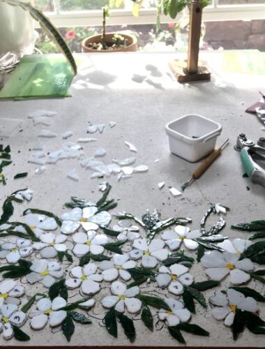 A table with flowers and tools on it