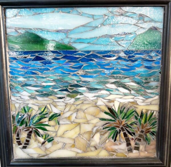 A mosaic of the ocean with palm trees in it.